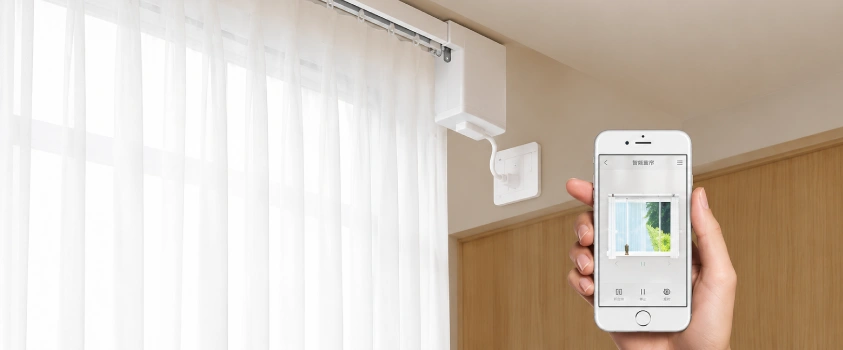 Motorized curtain track controlled from a smartphone app
